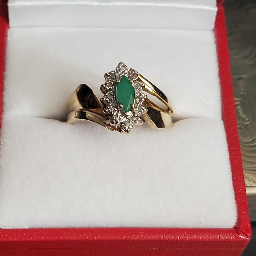 10k emerald & diamond ring size 7. Could be resized by a jeweler. Stamped 10k. G